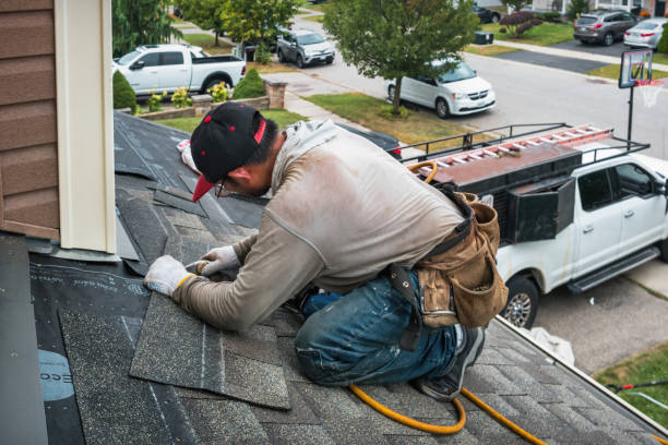 Professional Roofing technician working in New Smyrna Beach, FL
